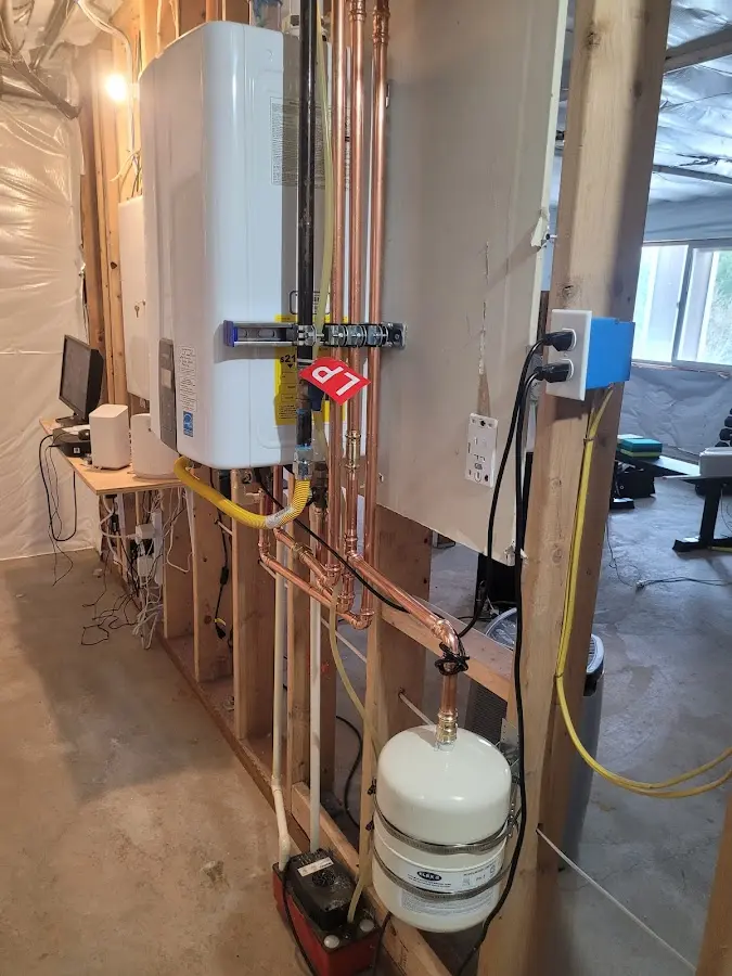 Licensed plumber repairing a kitchen sink in Racine
