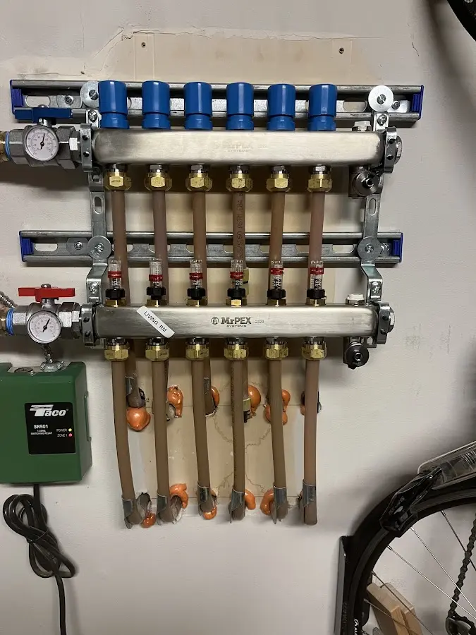 Plumber performing Water Heater Repair at a residential property in Racine